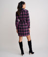 Model is wearing UNTUCKit Cassie dress in purple plaid. 