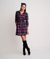 Model is wearing UNTUCKit Cassie dress in purple plaid. 