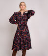 Model is wearing UNTUCKit Soft Crinkle Ikat Maya Dress. 