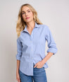 Model is wearing UNTUCKit  Wrinkle-Free Stretch Cotton Bella Shirt in blue and white stripe.