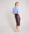 Model is wearing UNTUCKit Faux Leather Penicli Aubrey Skirt.