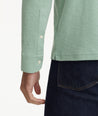 Model is wearing UNTUCKit Agrill Heavyweight Polo in Granite Green.