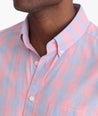 Model is wearing UNTUCKit Bookman vintage wash plaid shirt in pink.