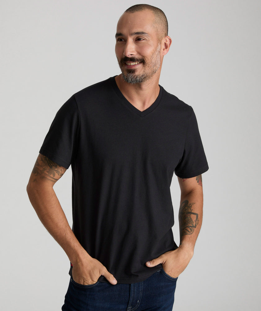 Model wearing a Black Ultrasoft V-Neck Tee.