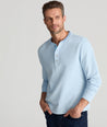 Model is wearing UNTUCKit Cascudo LS Pique Henley in Blue Bell.