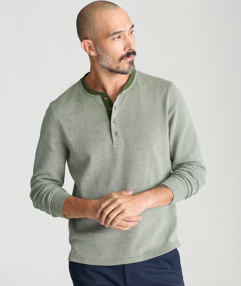 Model is wearing UNTUCKit Cascudo LS Pique Henley in Rifle Green.