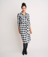 Model is wearing UNTUCKit Colby dress in black plaid.