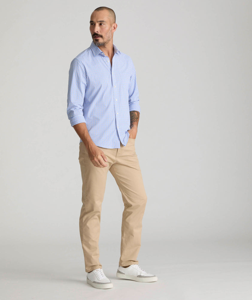 Model is wearing UNTUCKit 5-Pocket Chino Pants in Khaki.