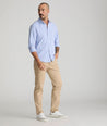 Model is wearing UNTUCKit 5-Pocket Chino Pants in Khaki.