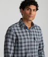 Model is wearing UNTUCKit Plaid Flannel Shirt  in Gray & Light Blue Plaid | Fair Trade Certified™. 