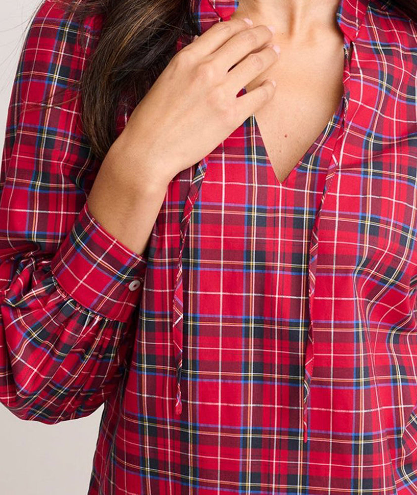 Model is wearing UNTUCKit Joy shirt in red plaid. 