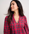 Model is wearing UNTUCKit Joy shirt in red plaid. 