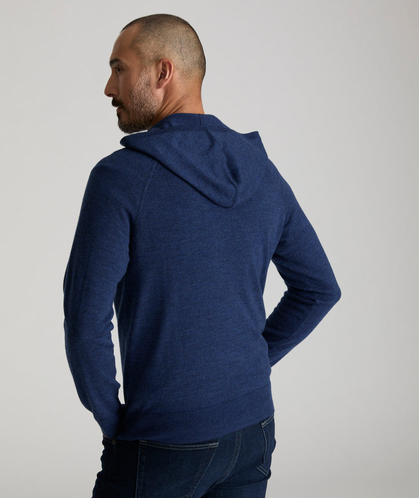 Model is wearing UNTUCKit Merino Hoodie in solid twilight blue. 