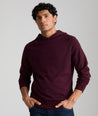 Model is wearing UNTUCKit Merino Hoodie in solid Burgundy. 