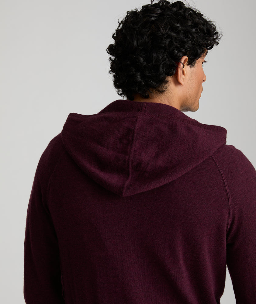 Model is wearing UNTUCKit Merino Hoodie in solid Burgundy. 