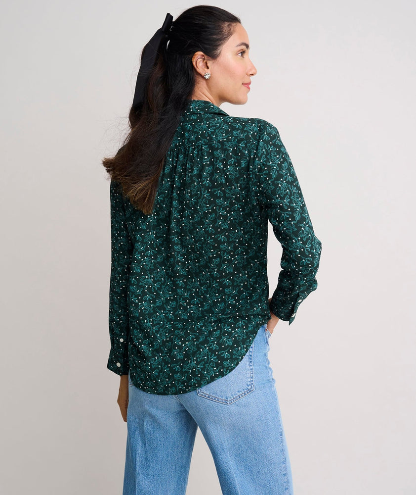 Model is wearing UNTUCKit Natalie top in green.