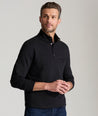 Model is wearing UNTUCKit Snap Fleece Pullover in black.