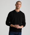 Model is wearing UNTUCKit sweater in black.