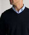 Model is wearing UNTUCKit sweater in navy.