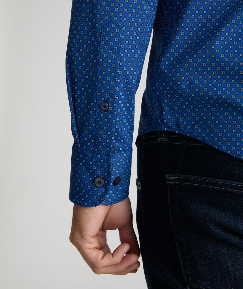 Model is wearing UNTUCKit Stanton shirt in blue Dimond print.  