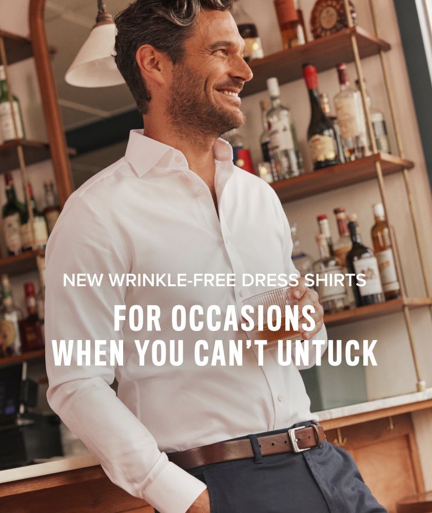 Model is wearing UNTUCKit Spencer shirt in white. New Wrinkle Free Dress Shirts — for occasions when you can't untuck